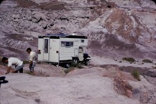 Wide shot showing the 1969 CJ5 Camper and the expansive landscape at Petrified Forest.